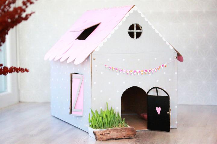 Casa de muñecas de cartón para gatito