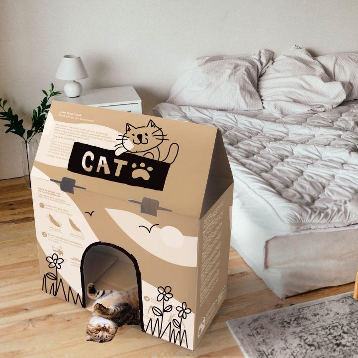 Casa para gatos en caja de cartón