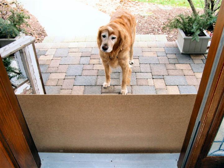 Sliding Dog Gate Protects Door from Scratches