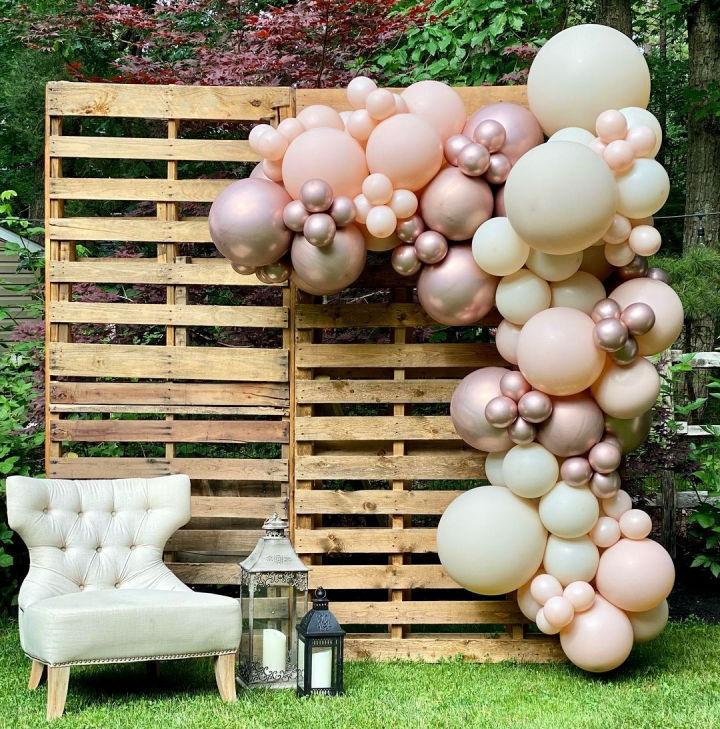 Pallet Backdrop With Balloon Garland