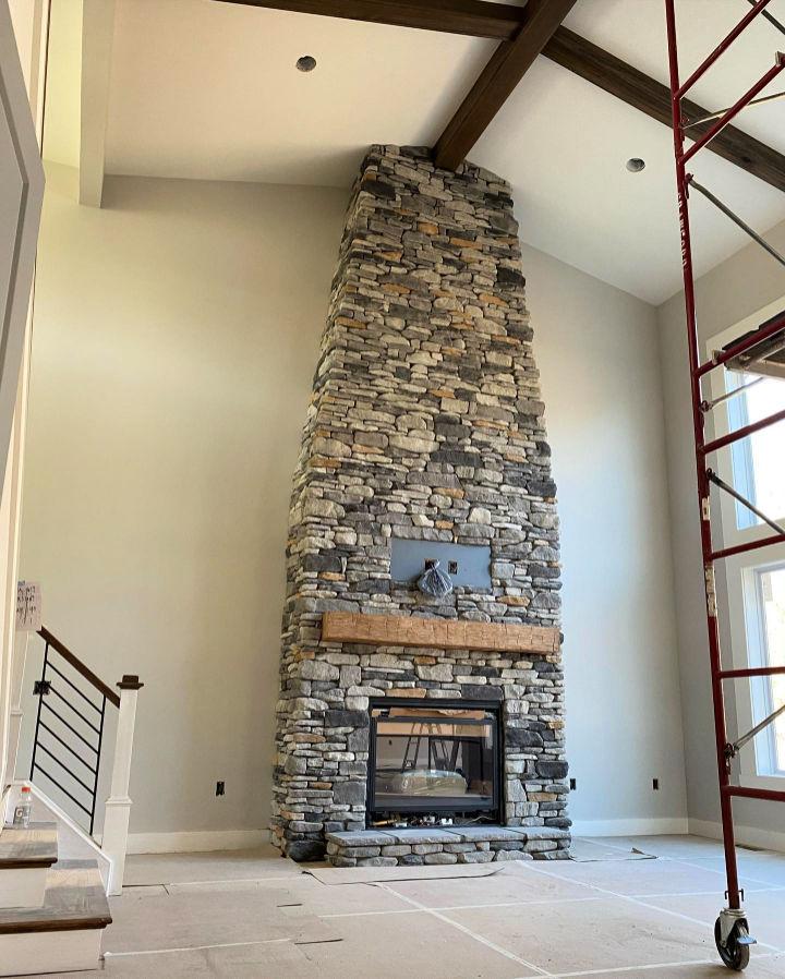 Stunning 2 Story Stone Fireplace Design